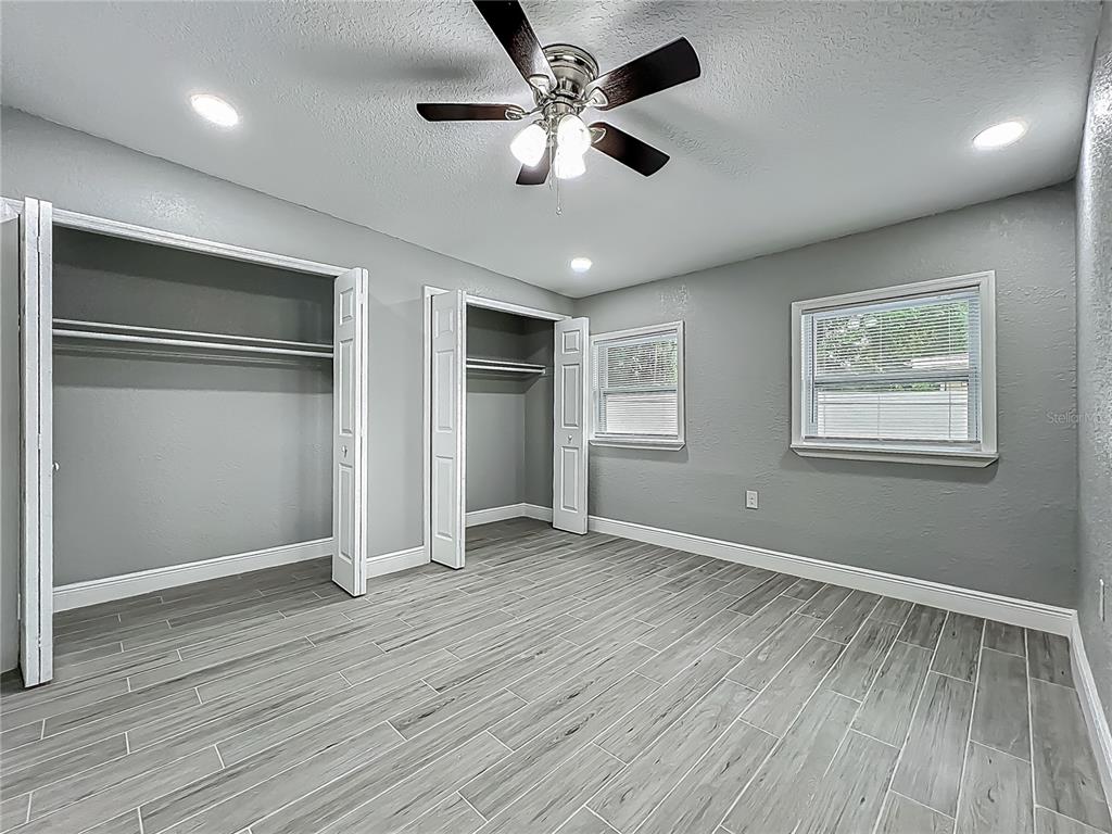 1414 Beaver Street Orlando, FL 32806 - Photo 24 of 43 a view of an empty room with window and wooden floor