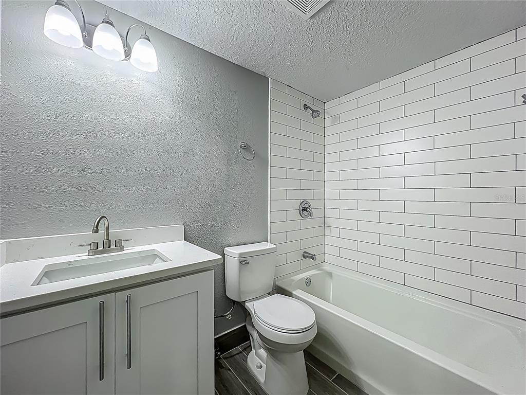 1414 Beaver Street Orlando, FL 32806 - Photo 25 of 43 a bathroom with a sink a toilet and shower