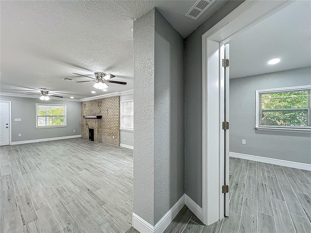 1414 Beaver Street Orlando, FL 32806 - Photo 26 of 43 a view of an empty room with a window and wooden floor