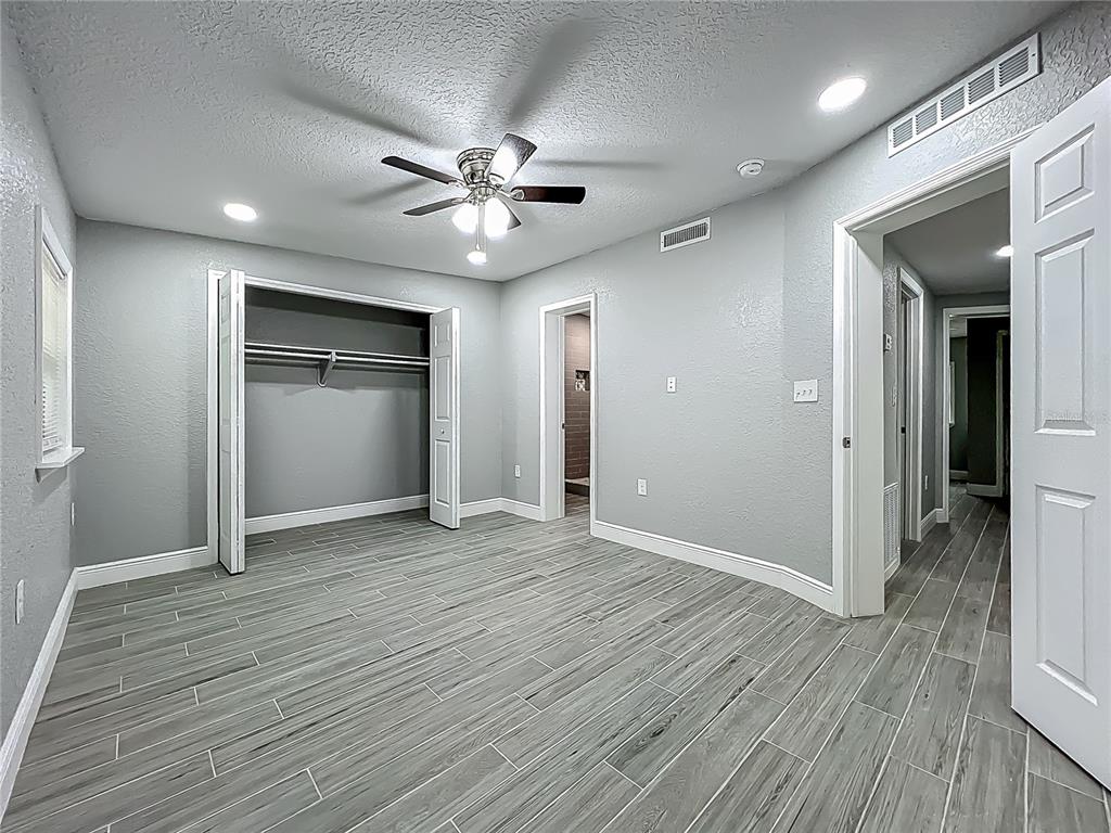 1414 Beaver Street Orlando, FL 32806 - Photo 27 of 43 a view of an empty room with wooden floor