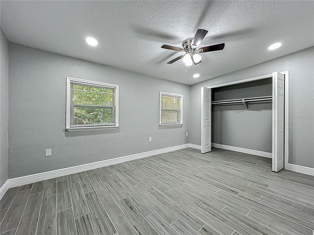 1414 Beaver Street Orlando, FL 32806 - Photo 28 of 43 a view of an empty room with window and wooden floor