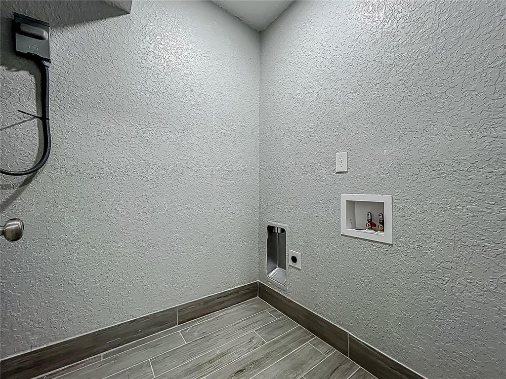 1414 Beaver Street Orlando, FL 32806 - Photo 31 of 43 a view of a room with wooden floor and small window