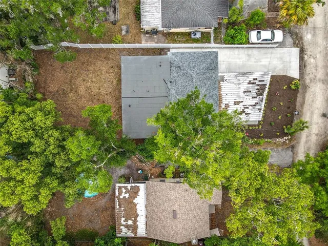 an aerial view of residential house with outdoor space