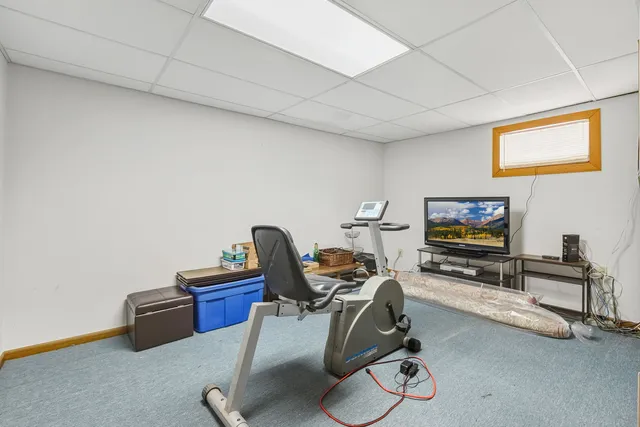 a room with furniture and a flat screen tv