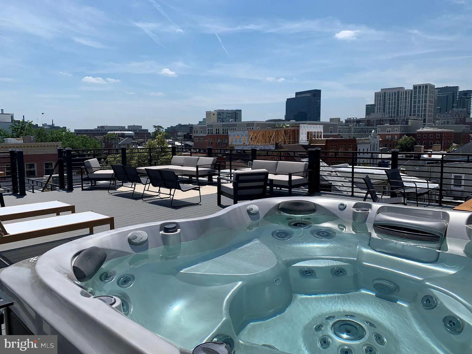 1742 Fleet Street, Unit 301 Baltimore, MD 21231 - Photo 14 of 20 a view of a swimming pool with outdoor seating