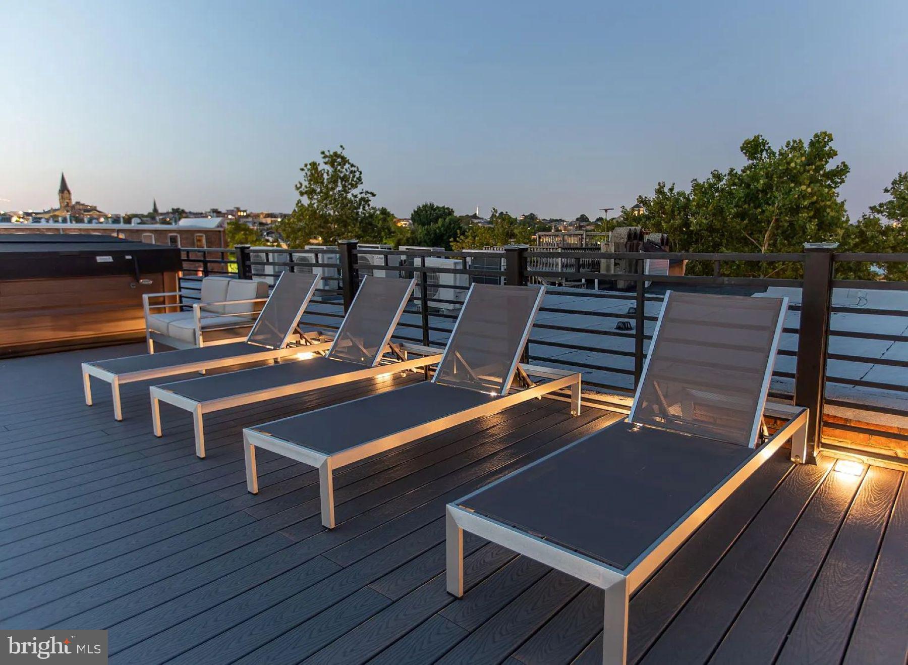 1742 Fleet Street, Unit 301 Baltimore, MD 21231 - Photo 15 of 20 a view of a roof deck with wooden floor and seating space