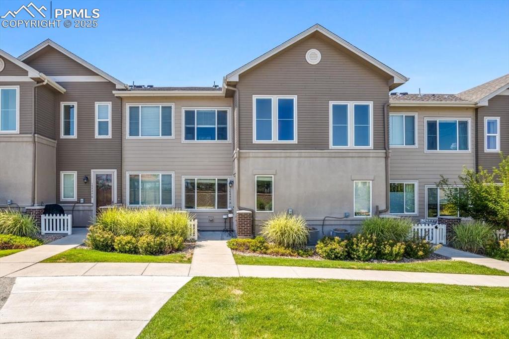 a front view of a house with a yard