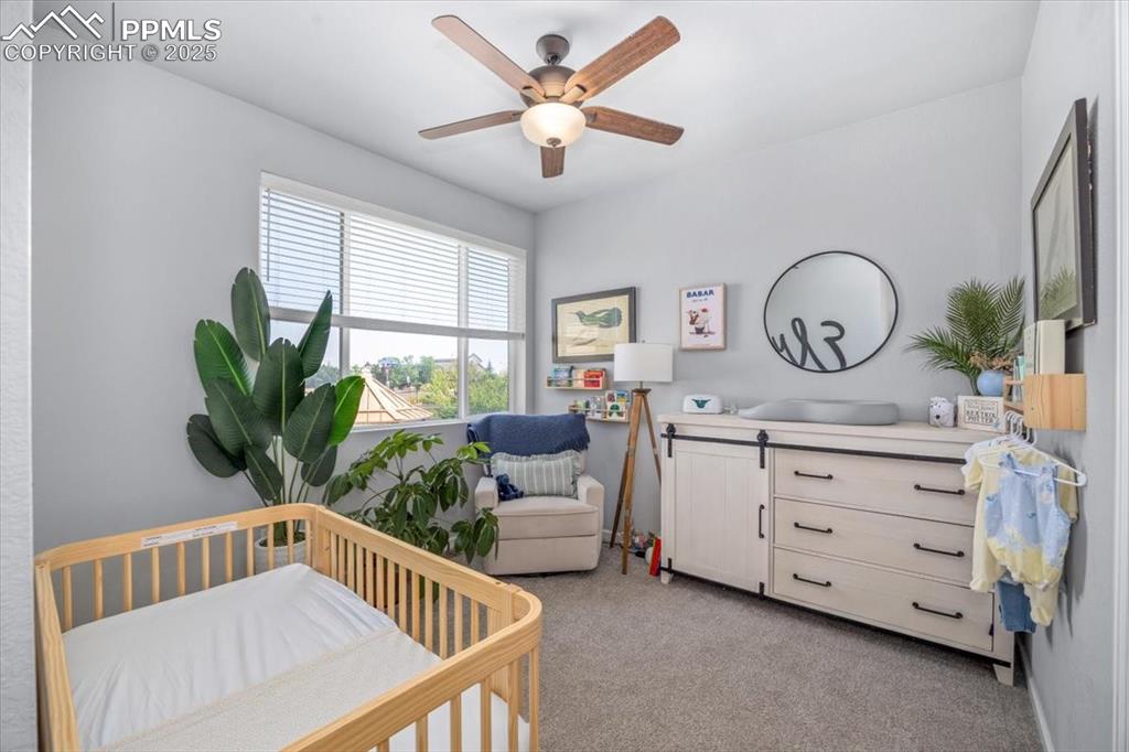 15446 West 64th Loop, Unit D Arvada, CO 80007 - Photo 15 of 22 a living room with furniture and a large window