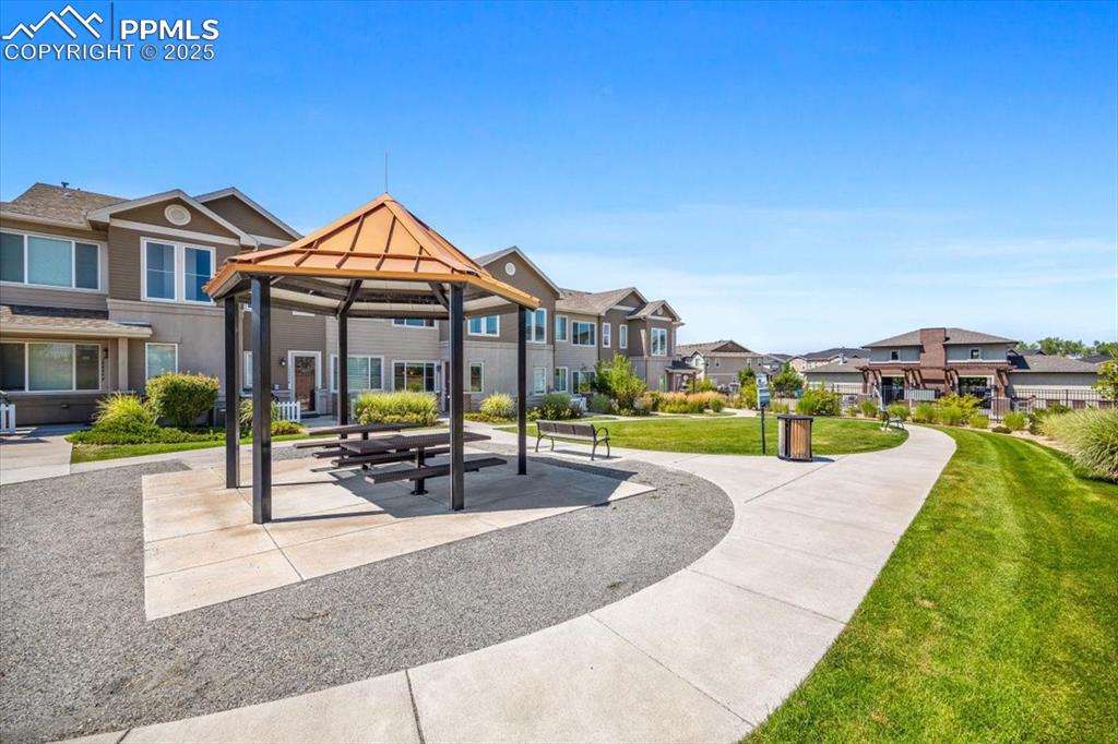 15446 West 64th Loop, Unit D Arvada, CO 80007 - Photo 19 of 22 a view of a house with swimming pool and porch