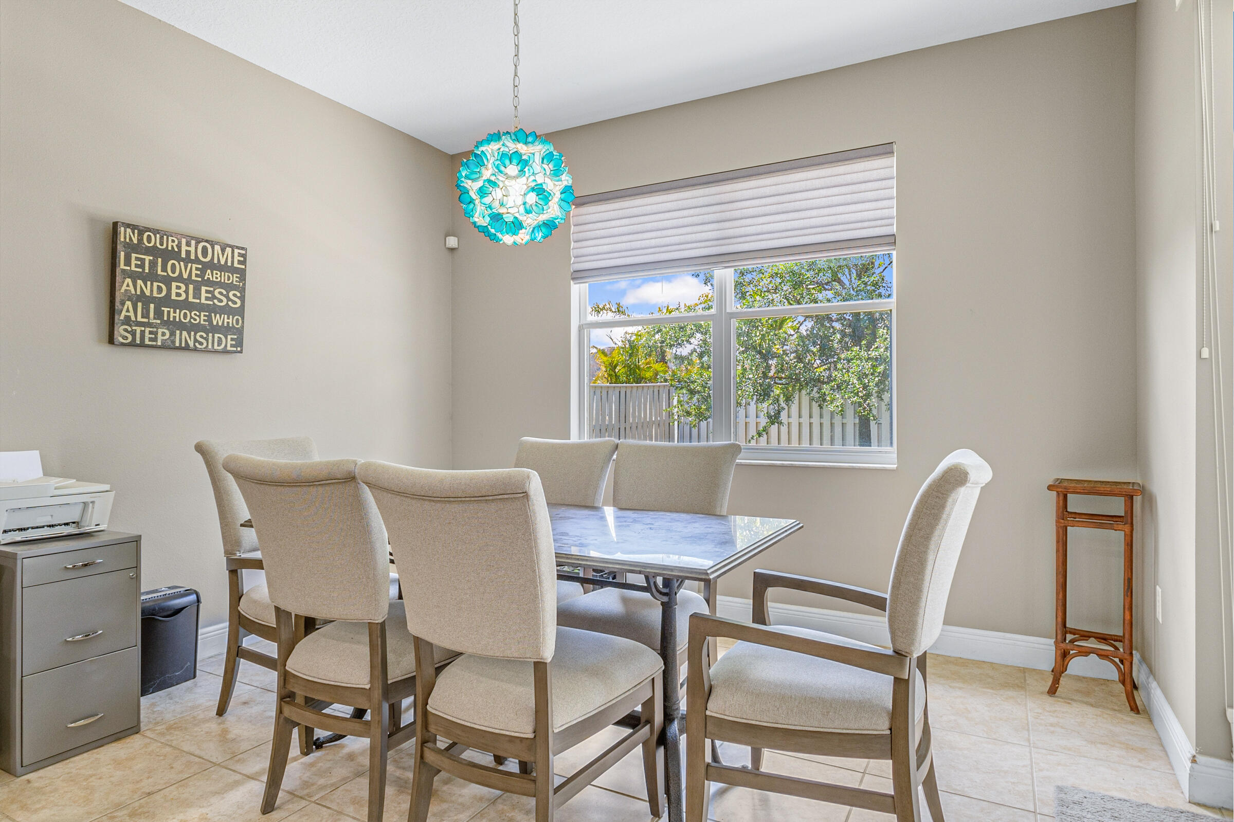 6002 Goleta Circle Melbourne, FL 32940 - Photo 11 of 45 a view of a dining room with furniture a chandelier and a window
