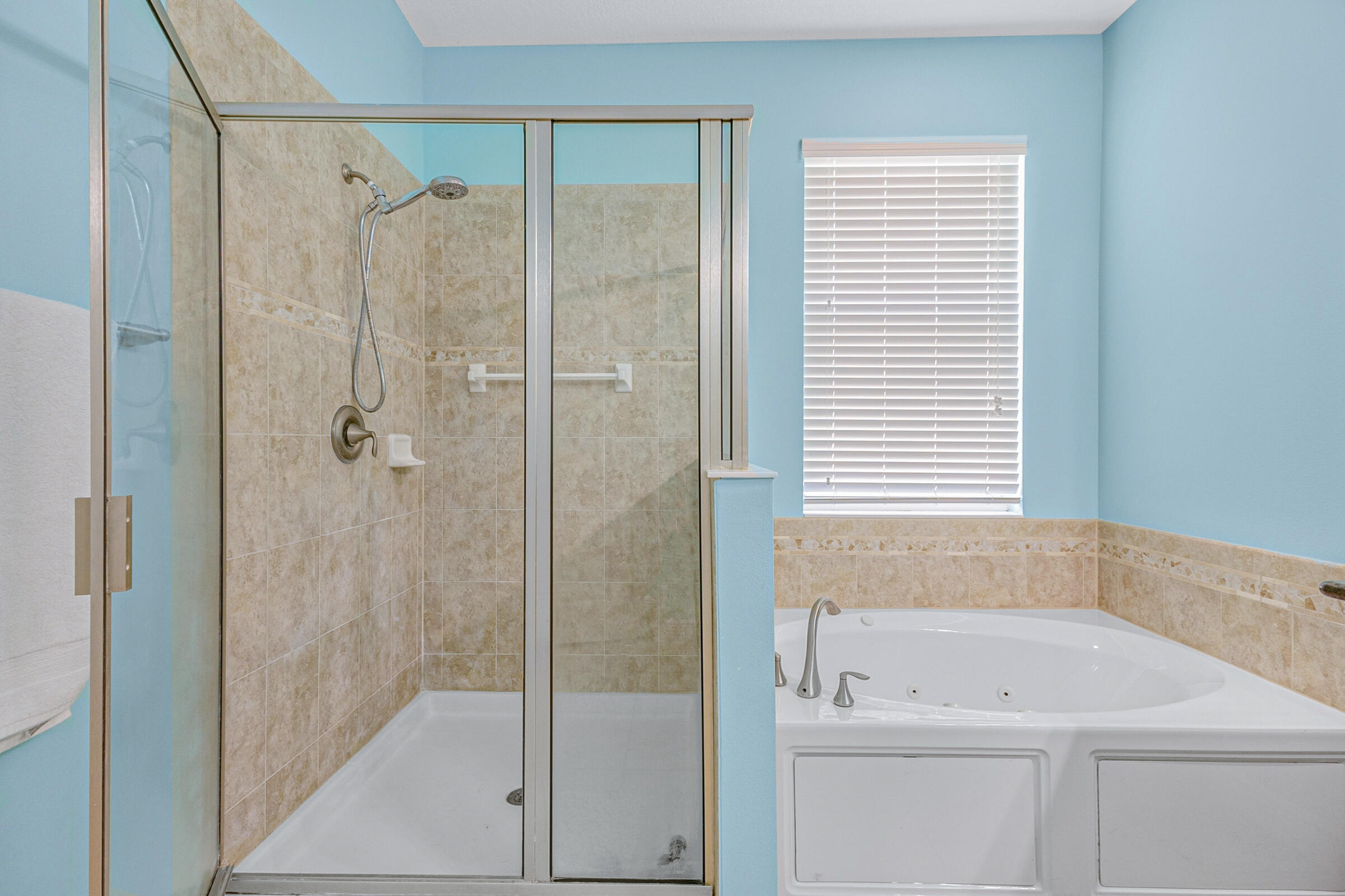 6002 Goleta Circle Melbourne, FL 32940 - Photo 17 of 45 a bathroom with a shower a sink and a window