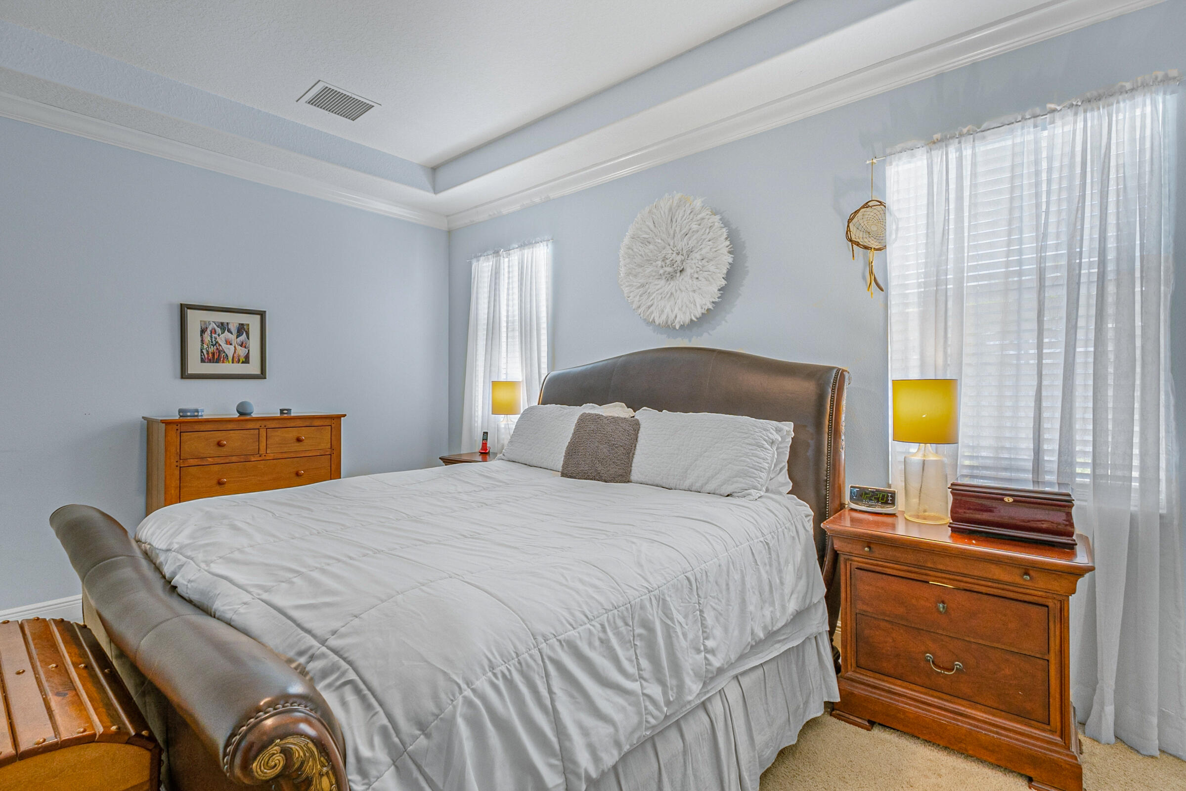 6002 Goleta Circle Melbourne, FL 32940 - Photo 18 of 45 a bedroom with a bed and dresser