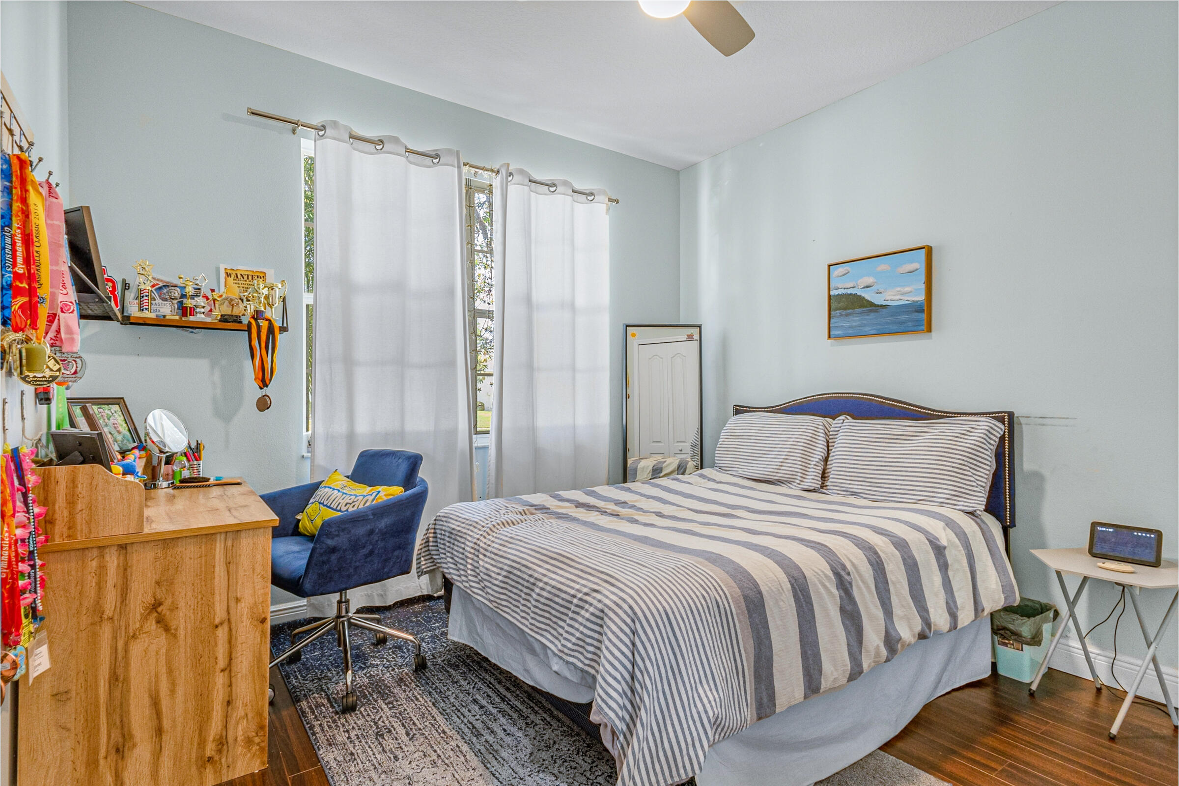 6002 Goleta Circle Melbourne, FL 32940 - Photo 19 of 45 a bedroom with a bed and a table in it