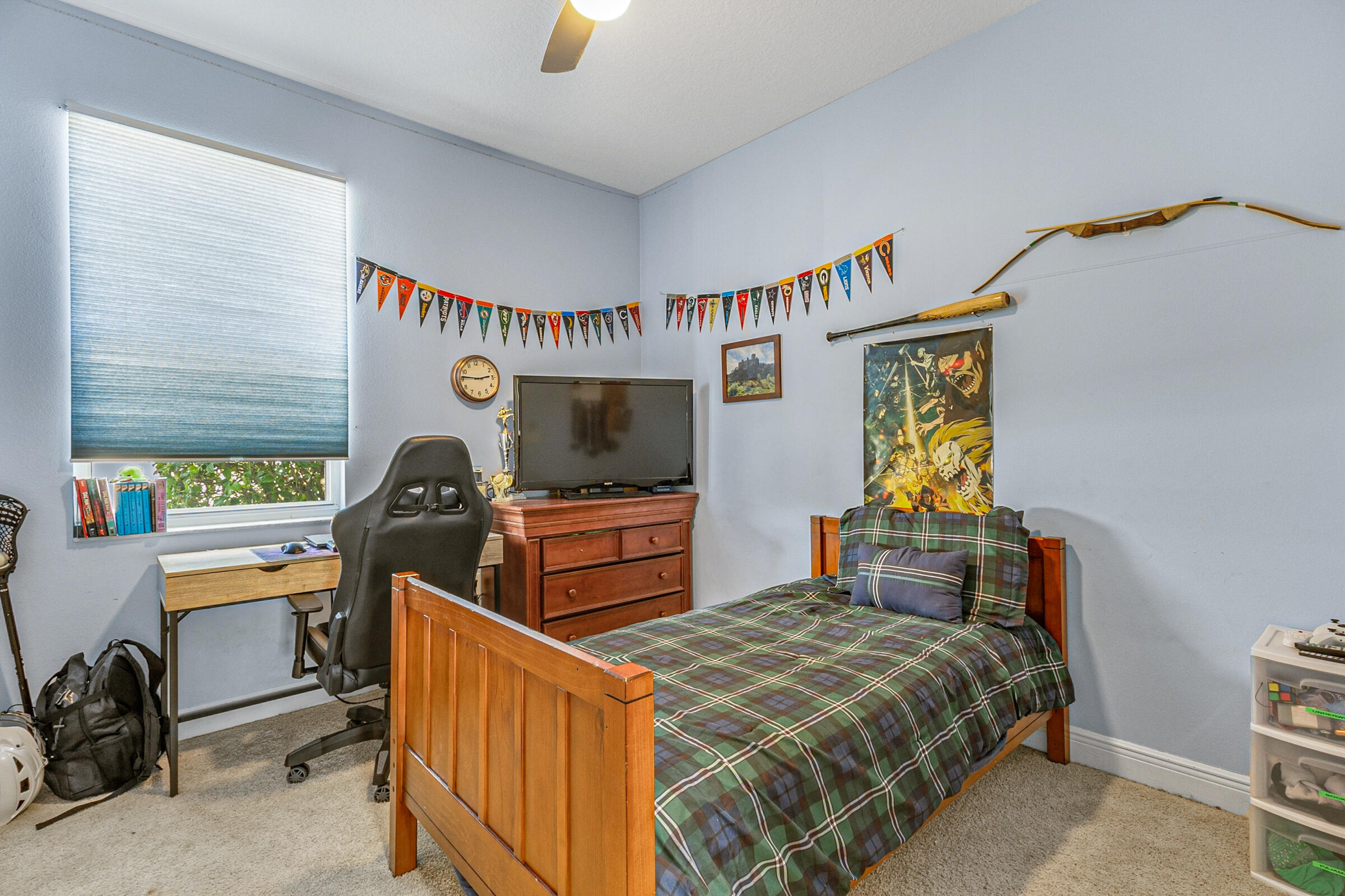 6002 Goleta Circle Melbourne, FL 32940 - Photo 21 of 45 a bedroom with furniture and a flat screen tv