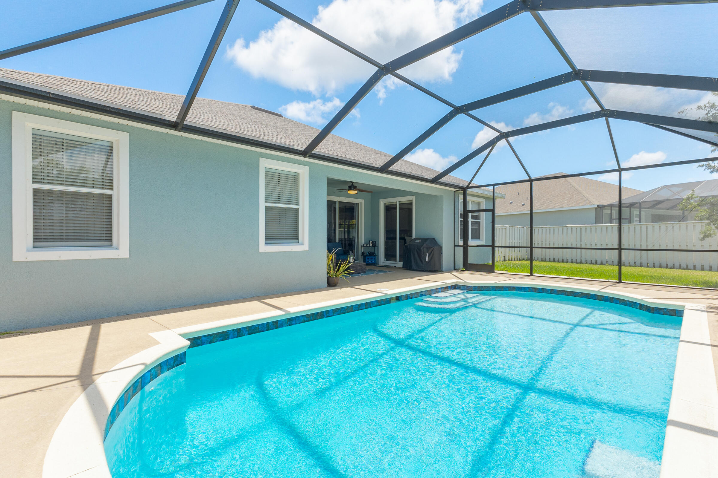 6002 Goleta Circle Melbourne, FL 32940 - Photo 26 of 45 a view of swimming pool with an outdoor seating