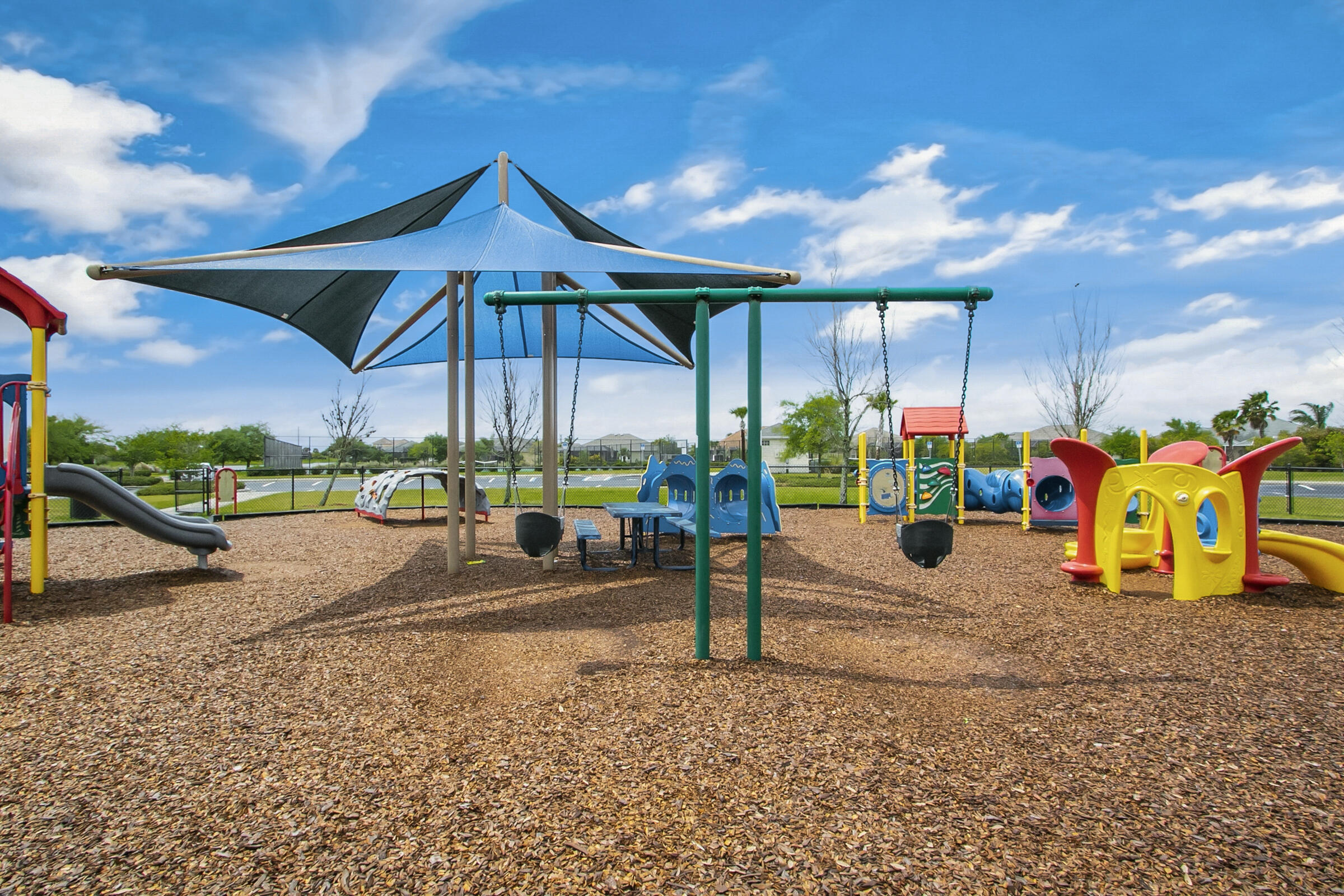 6002 Goleta Circle Melbourne, FL 32940 - Photo 34 of 45 a view of a slide with a table and chairs