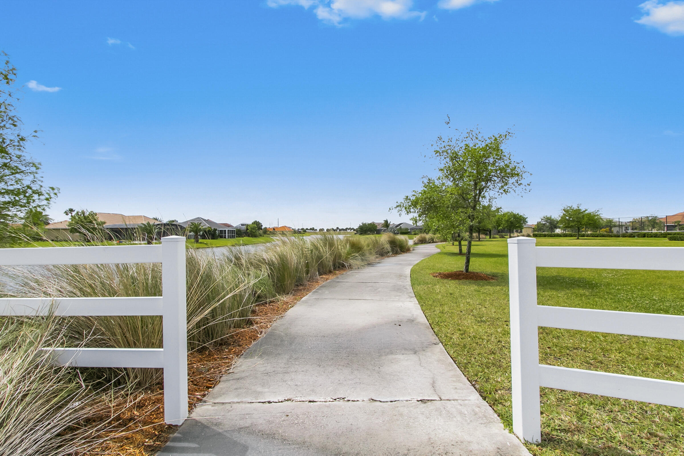 6002 Goleta Circle Melbourne, FL 32940 - Photo 42 of 45 a view of a pathway with a wrought fence