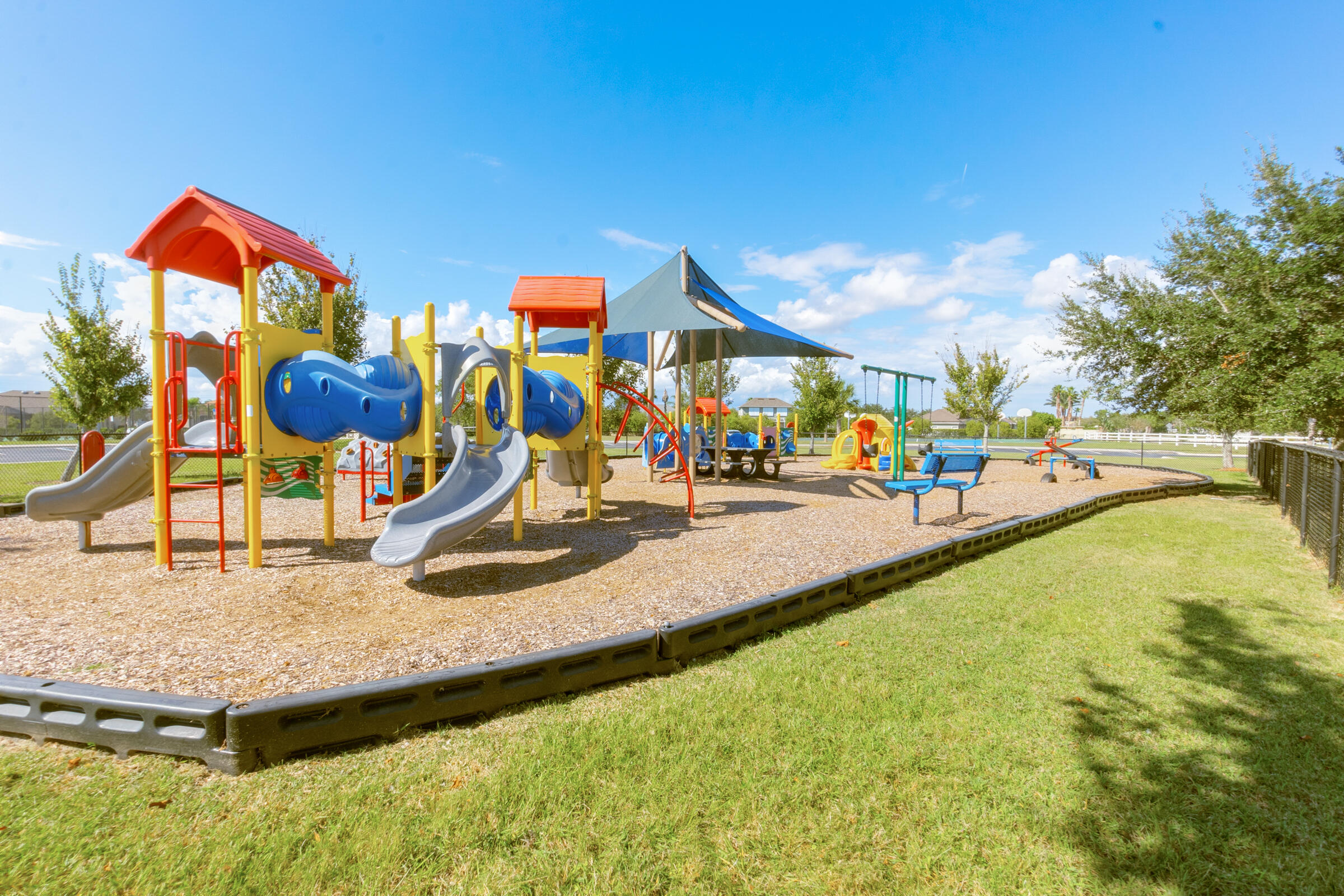 6002 Goleta Circle Melbourne, FL 32940 - Photo 43 of 45 a view of a swimming pool with a lawn chairs