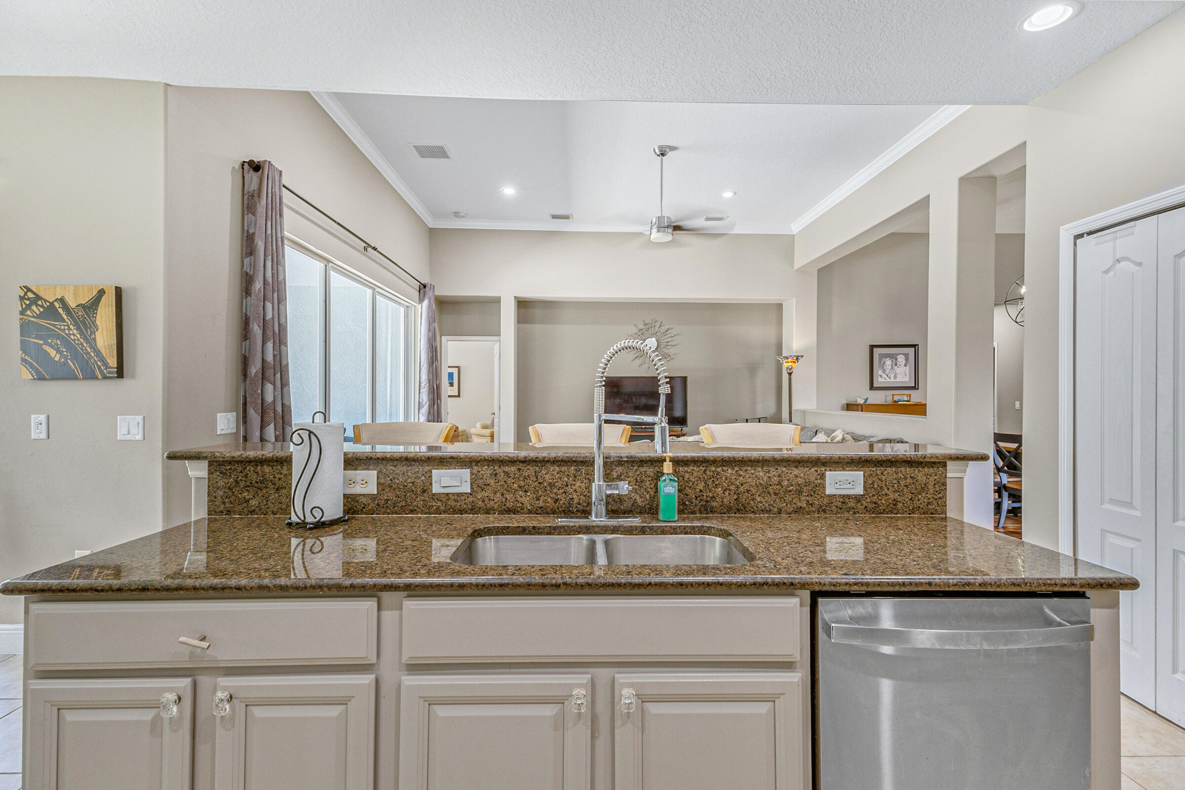 6002 Goleta Circle Melbourne, FL 32940 - Photo 10 of 45 a kitchen with granite countertop a sink and cabinets