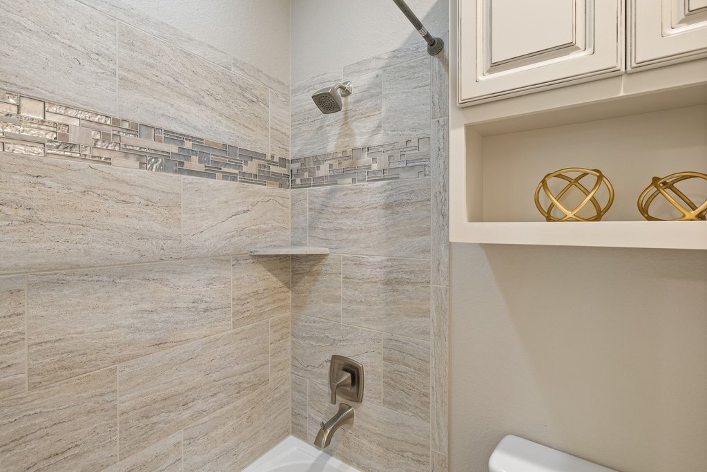 108 Berry Cove Georgetown, TX 78628 - Photo 27 of 39 a bathroom with a shower