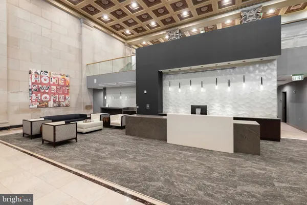 a view of a livingroom with furniture and a ceiling fan