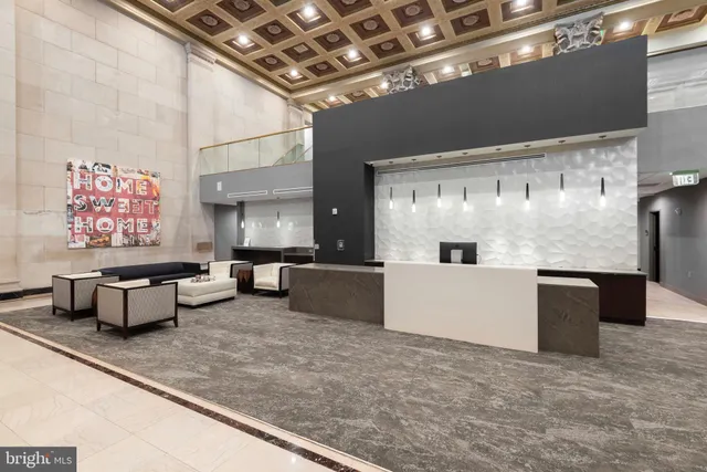 a view of a livingroom with furniture and a ceiling fan