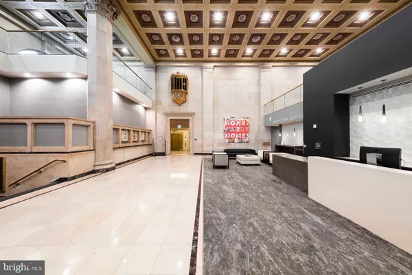 a view of kitchen with furniture and fireplace