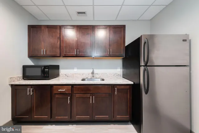 a view of a living room with furniture and a couch