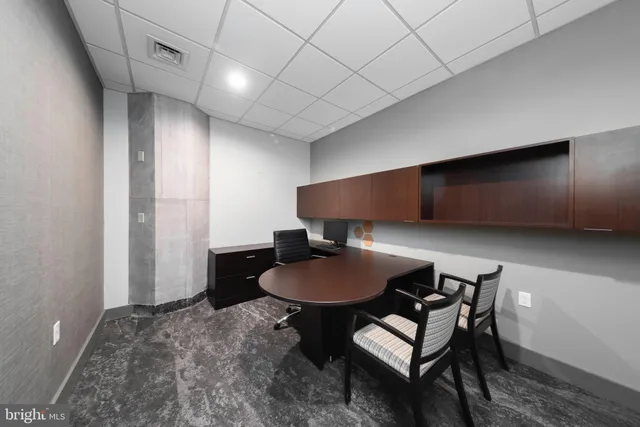 a view of a living room with a wooden floor