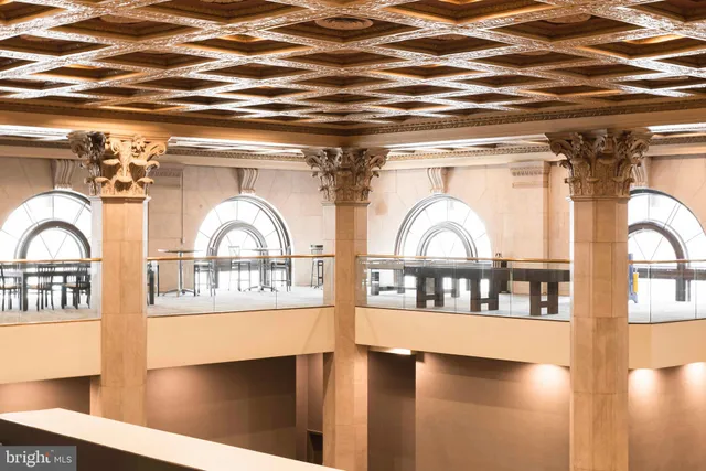 a kitchen with a stove a refrigerator and a sink