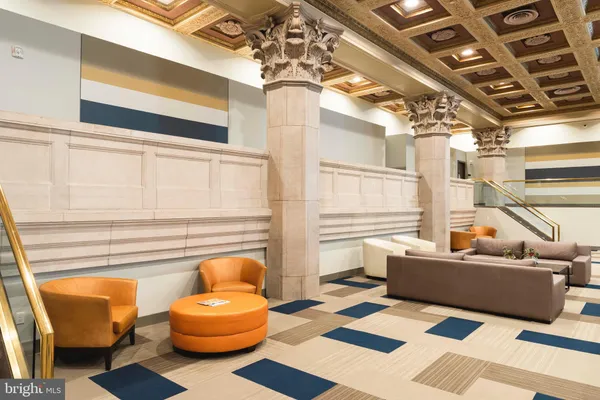 a dining room with furniture and a window