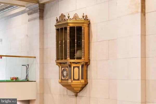 a view of a dining room with furniture and a chandelier