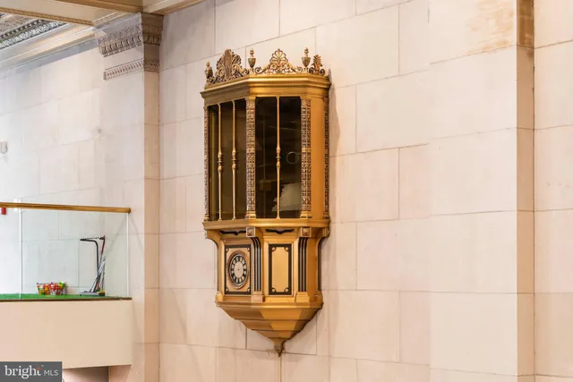 a view of a dining room with furniture and a chandelier