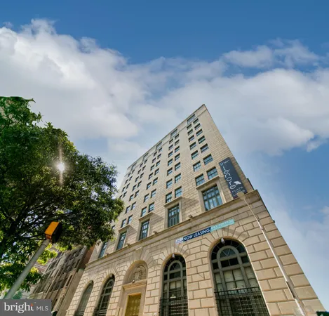 a bed room with a bed and a television