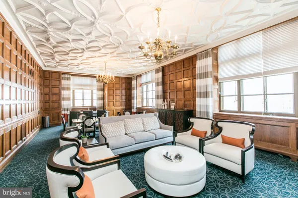 a view of hall way with furniture