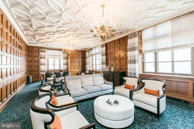 a view of hall way with furniture