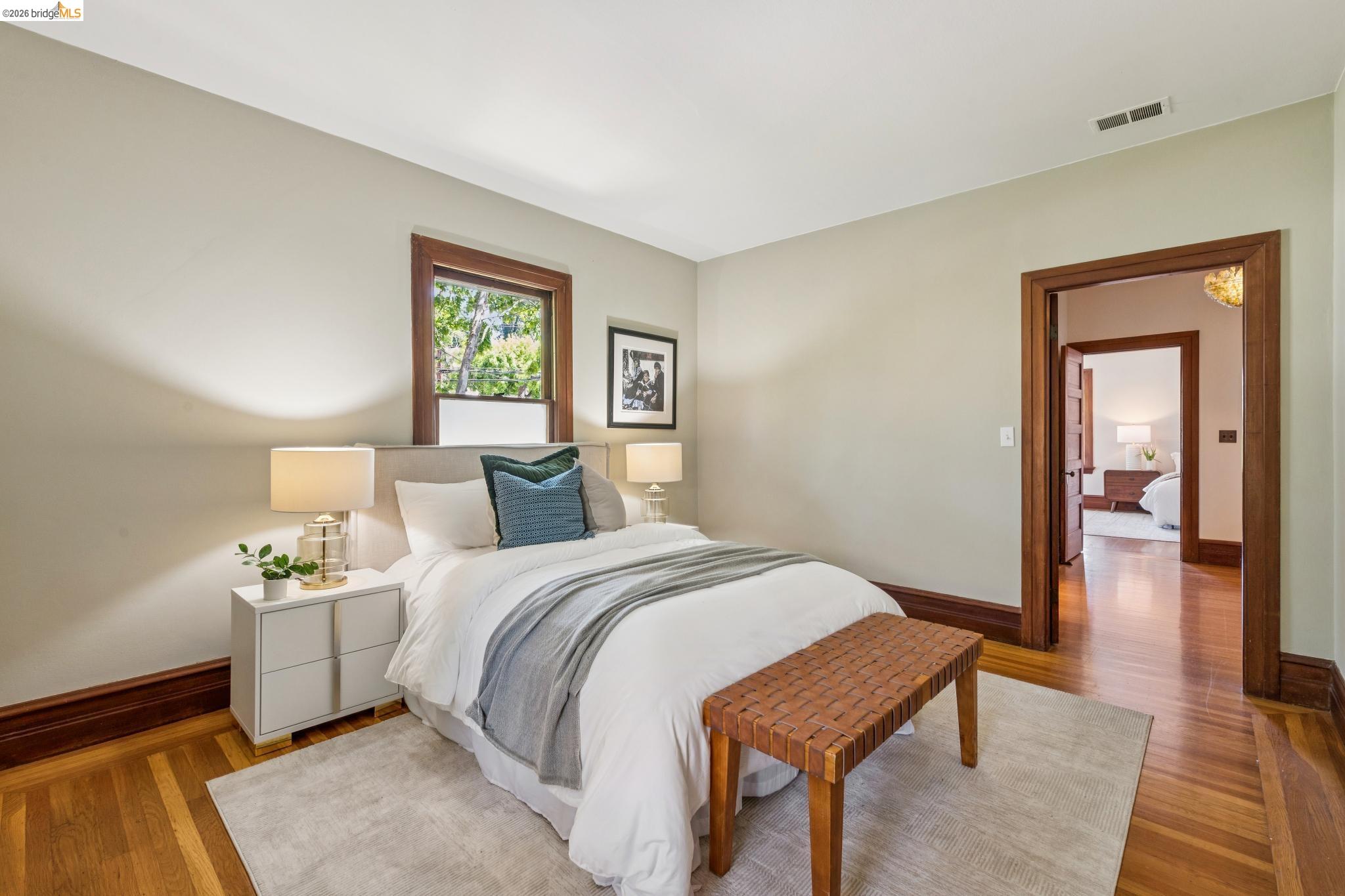 1490 Arch Street Berkeley, CA 94708 - Photo 33 of 57 a bedroom with a bed and a lamp on table