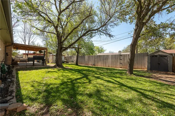 a backyard of a house with lots of green space