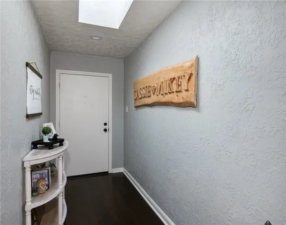 a view of an entryway with wooden floor