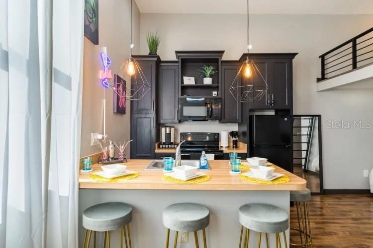 2004 North Howard Avenue, Unit 203 Tampa, FL 33607 - Photo 15 of 16 a kitchen with a dining table and chairs