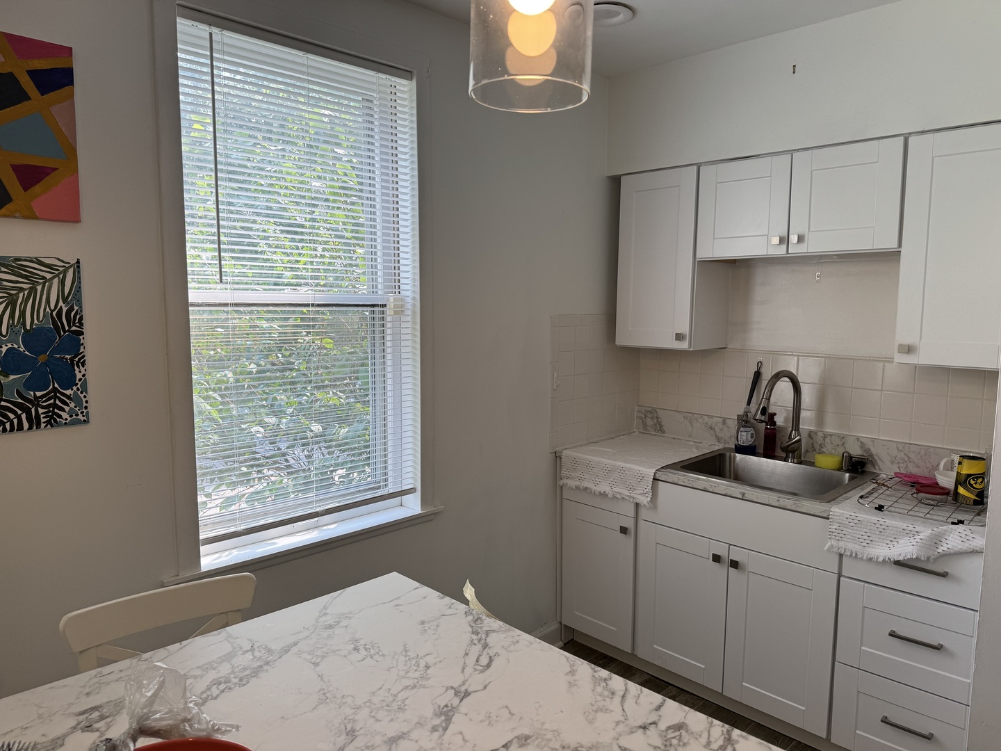 116 East Quincy Street, Unit 1 Riverside, IL 60546 - Photo 6 of 10 a kitchen with a sink cabinets and window