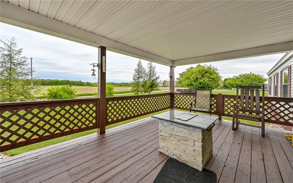 307 Hungarian Road Slippery Rock, PA 16057 - Photo 2 of 34 a view of a deck with wooden floor next to a yard