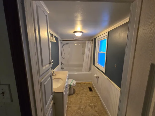 a bathroom with a tub and a shower