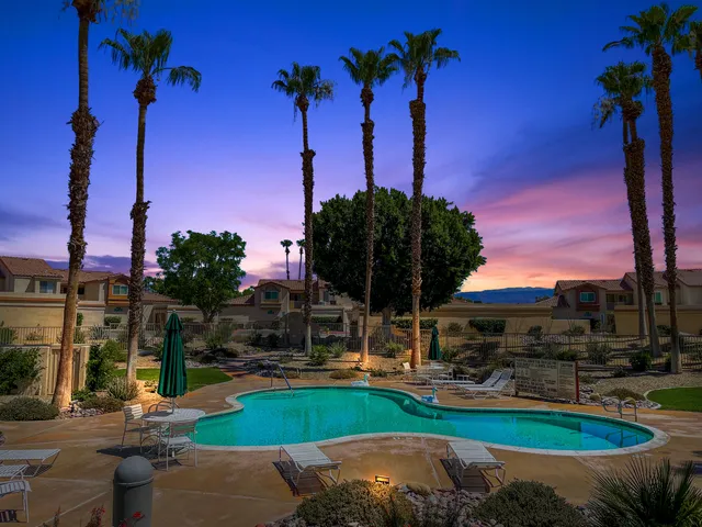 a view of a backyard with a fountain