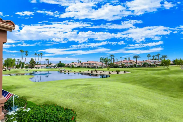 a view of a golf course with an outdoor space