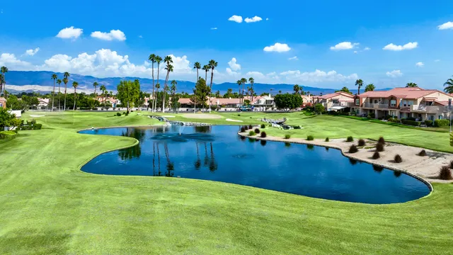 a view of a house with a swimming pool yard and outdoor seating