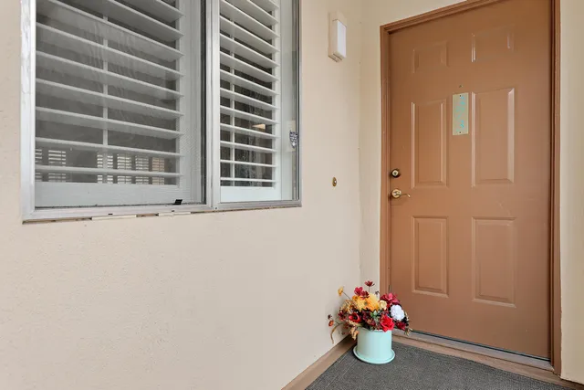 a bathroom with a window and a shower