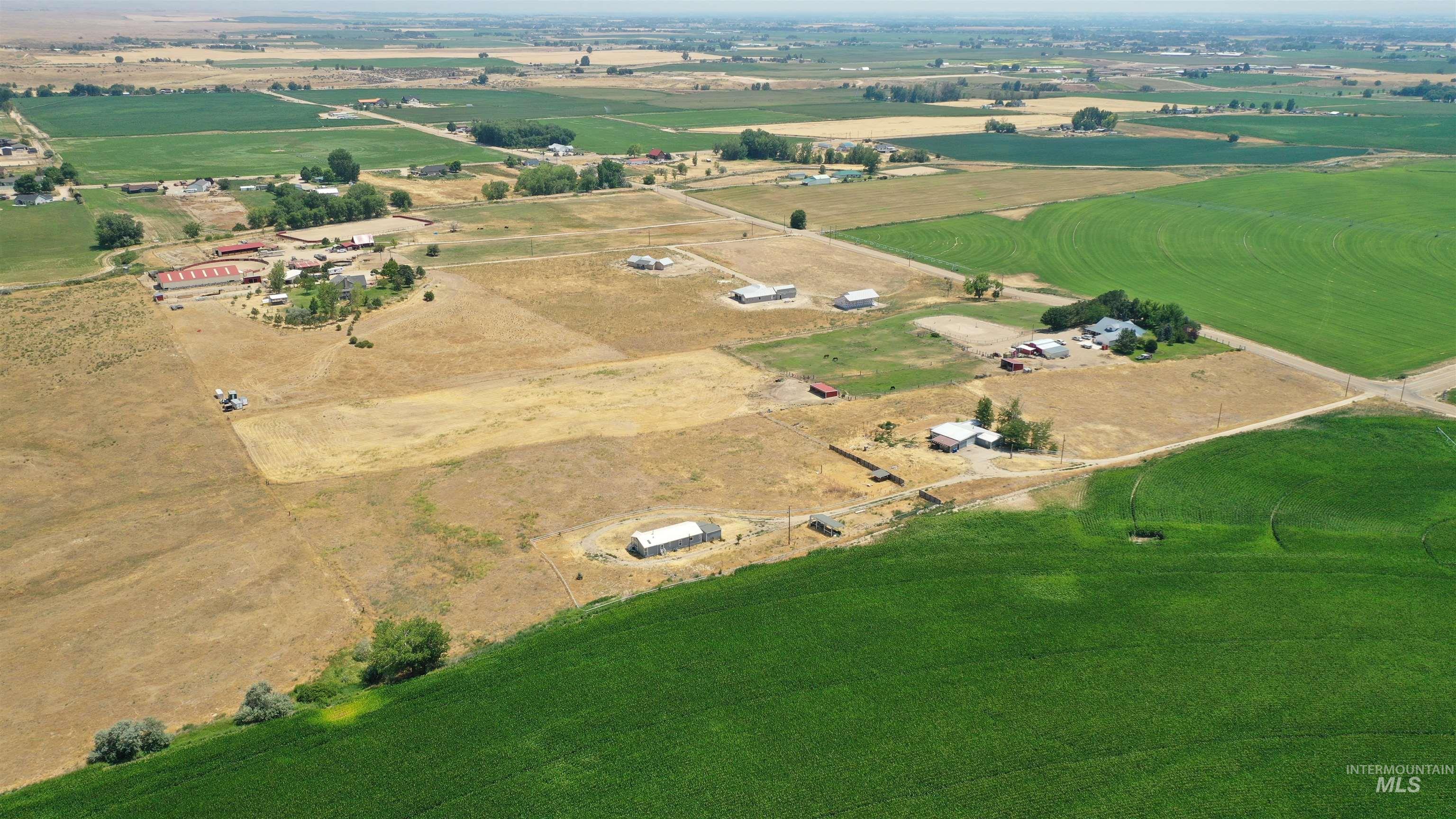 14490-14492 Sand Hollow Road Caldwell, ID 83607 - Photo 10 of 50 Aerial view of property and surrounding area with rural landscape