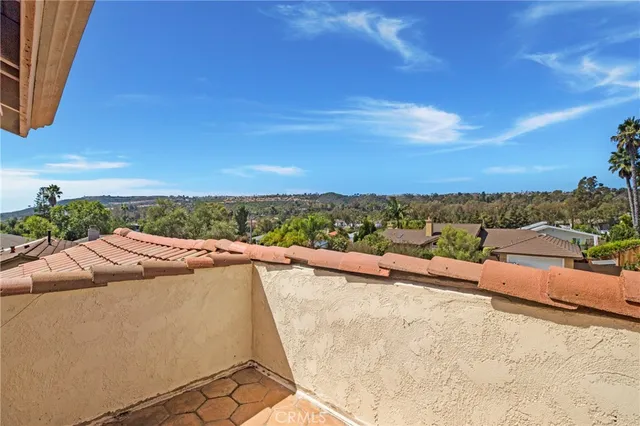 a view of balcony with furniture