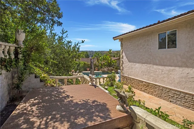 a view of a backyard with sitting area